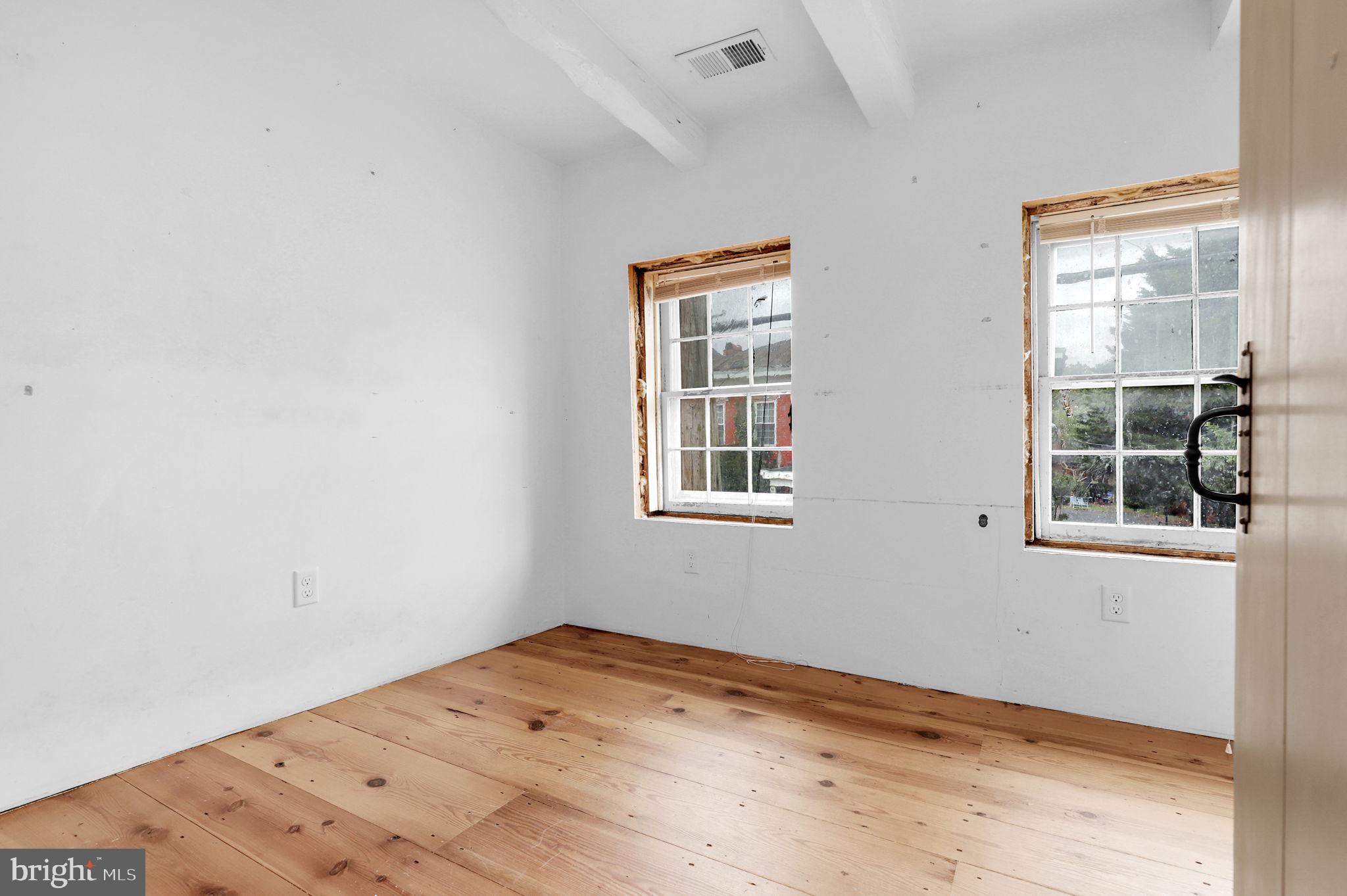 28 Potomac Street Boonsboro, MD 21713 - Photo 19 of 52 a view of a big room with wooden floor and windows