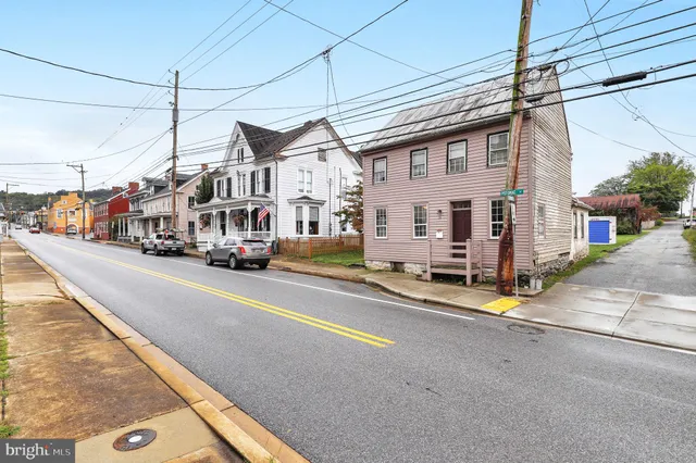 a view of a city street with tall buildings