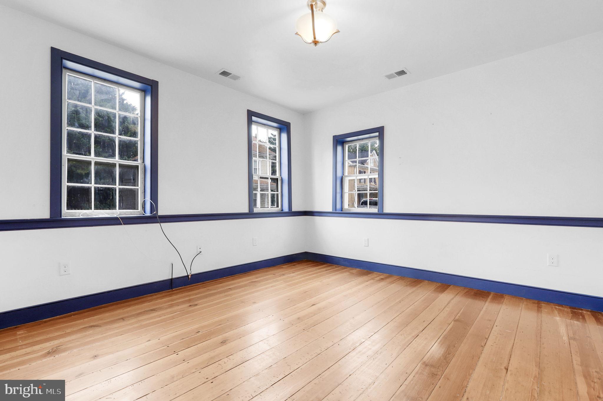 28 Potomac Street Boonsboro, MD 21713 - Photo 8 of 52 wooden floor in an empty room with a window