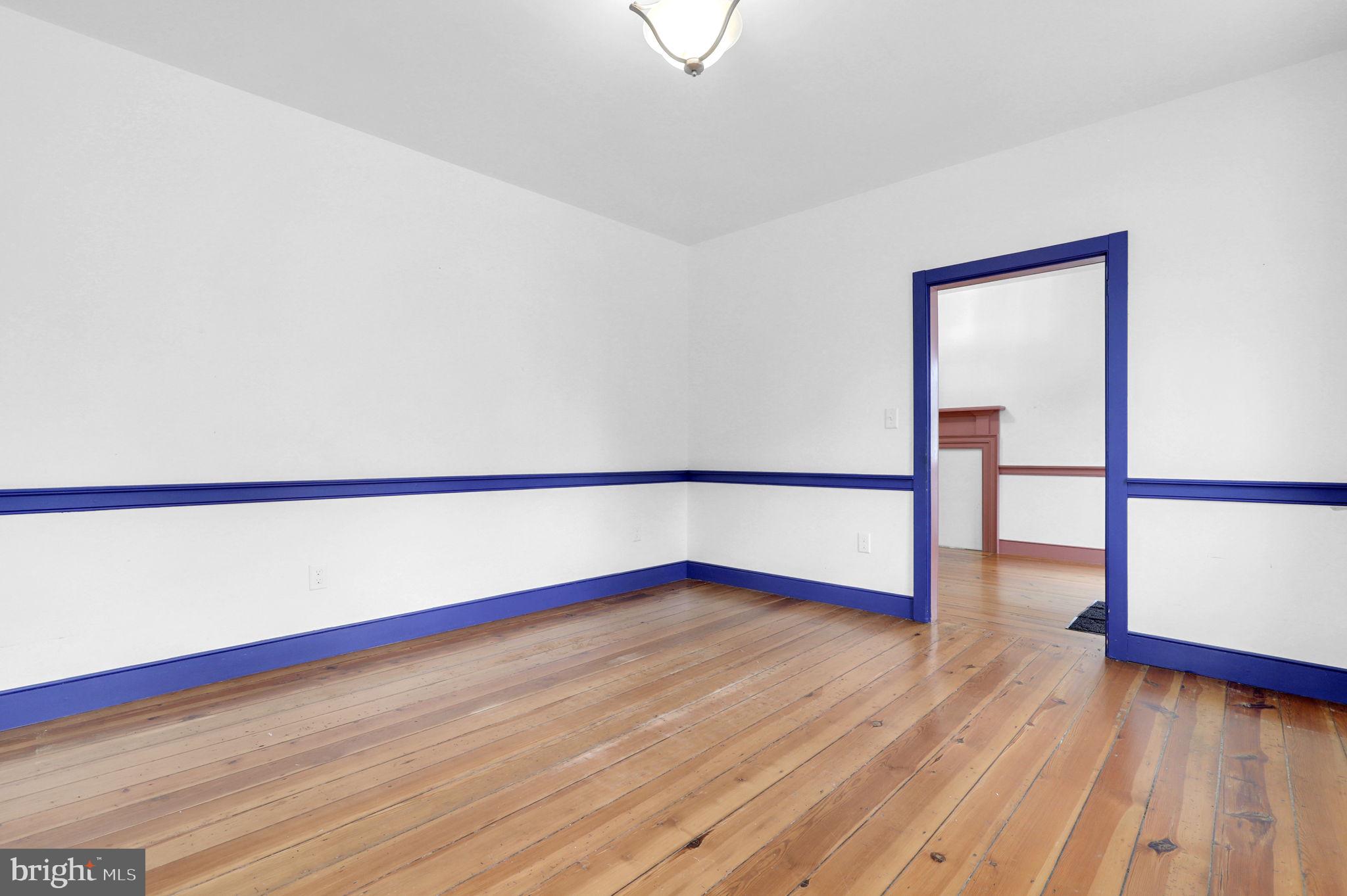 28 Potomac Street Boonsboro, MD 21713 - Photo 9 of 52 a view of an empty room with wooden floor