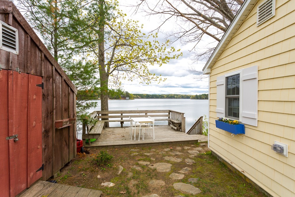 149 Lake Road Brookfield, MA 01506 - Photo 3 of 21 a view of a balcony with chairs and a barbeque