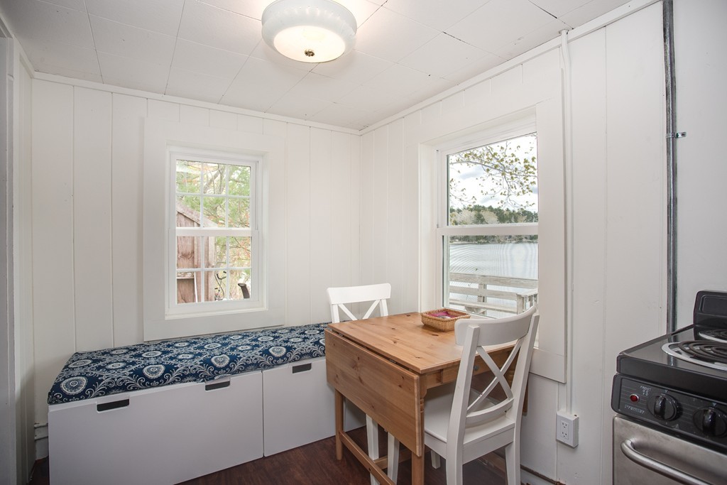 149 Lake Road Brookfield, MA 01506 - Photo 10 of 21 a dining room with a window and furniture