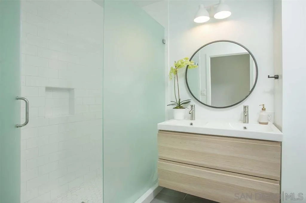 448 Marview Drive Solana Beach, CA 92075 - Photo 13 of 25 a bathroom with a sink and a mirror