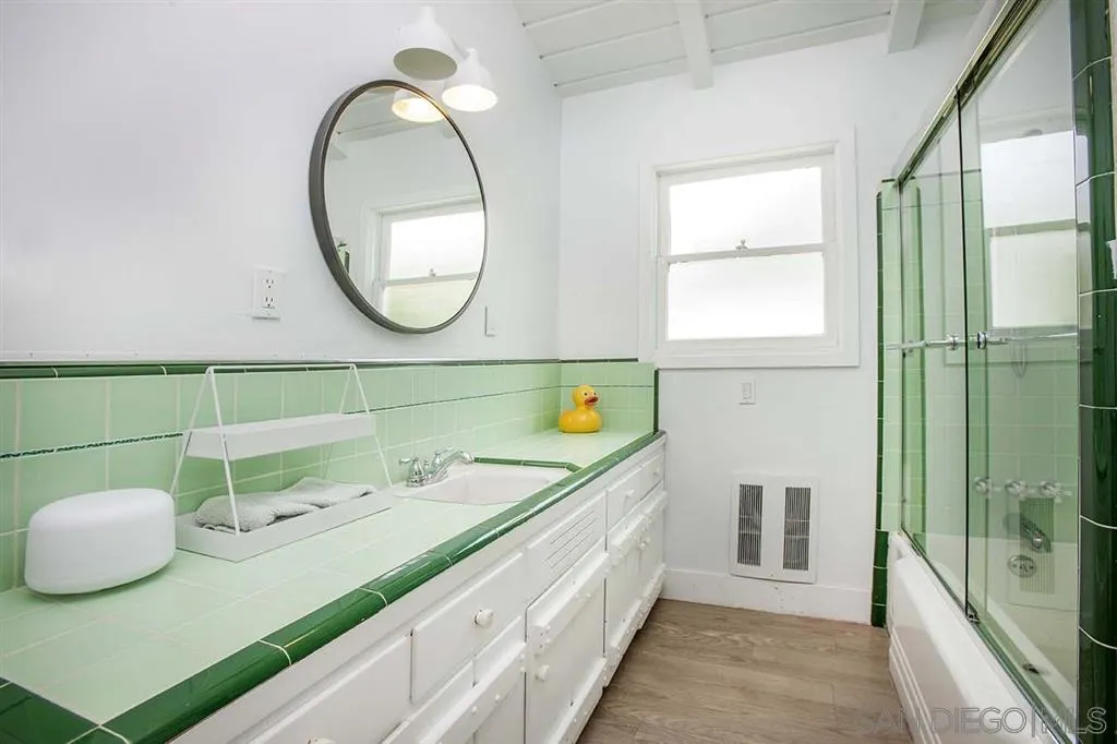 448 Marview Drive Solana Beach, CA 92075 - Photo 15 of 25 a bathroom with a sink and a mirror