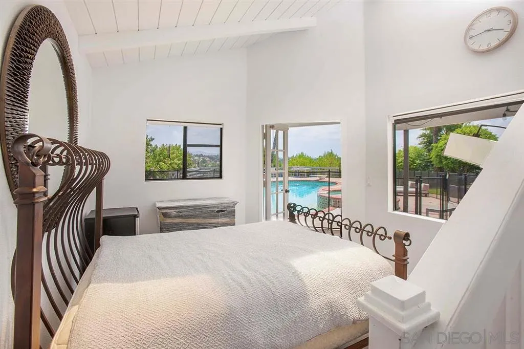 448 Marview Drive Solana Beach, CA 92075 - Photo 18 of 25 a bedroom with a bed and a window