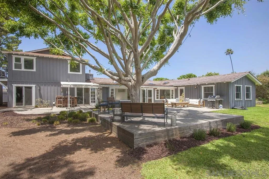 448 Marview Drive Solana Beach, CA 92075 - Photo 3 of 25 a front view of a house with garden and trees