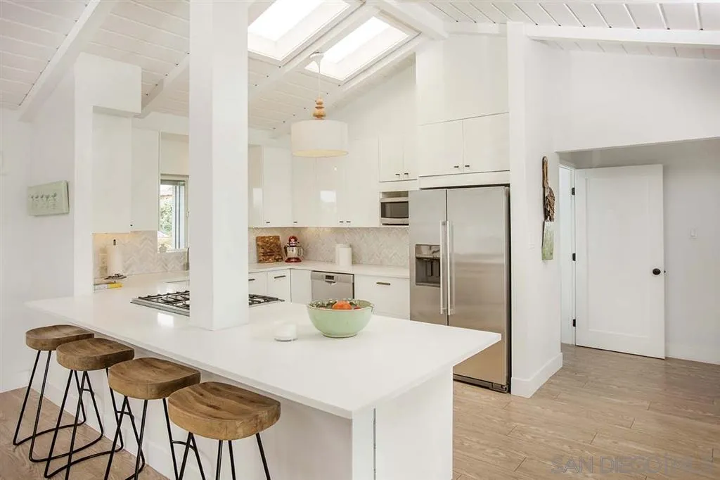 448 Marview Drive Solana Beach, CA 92075 - Photo 7 of 25 a kitchen with refrigerator and cabinets