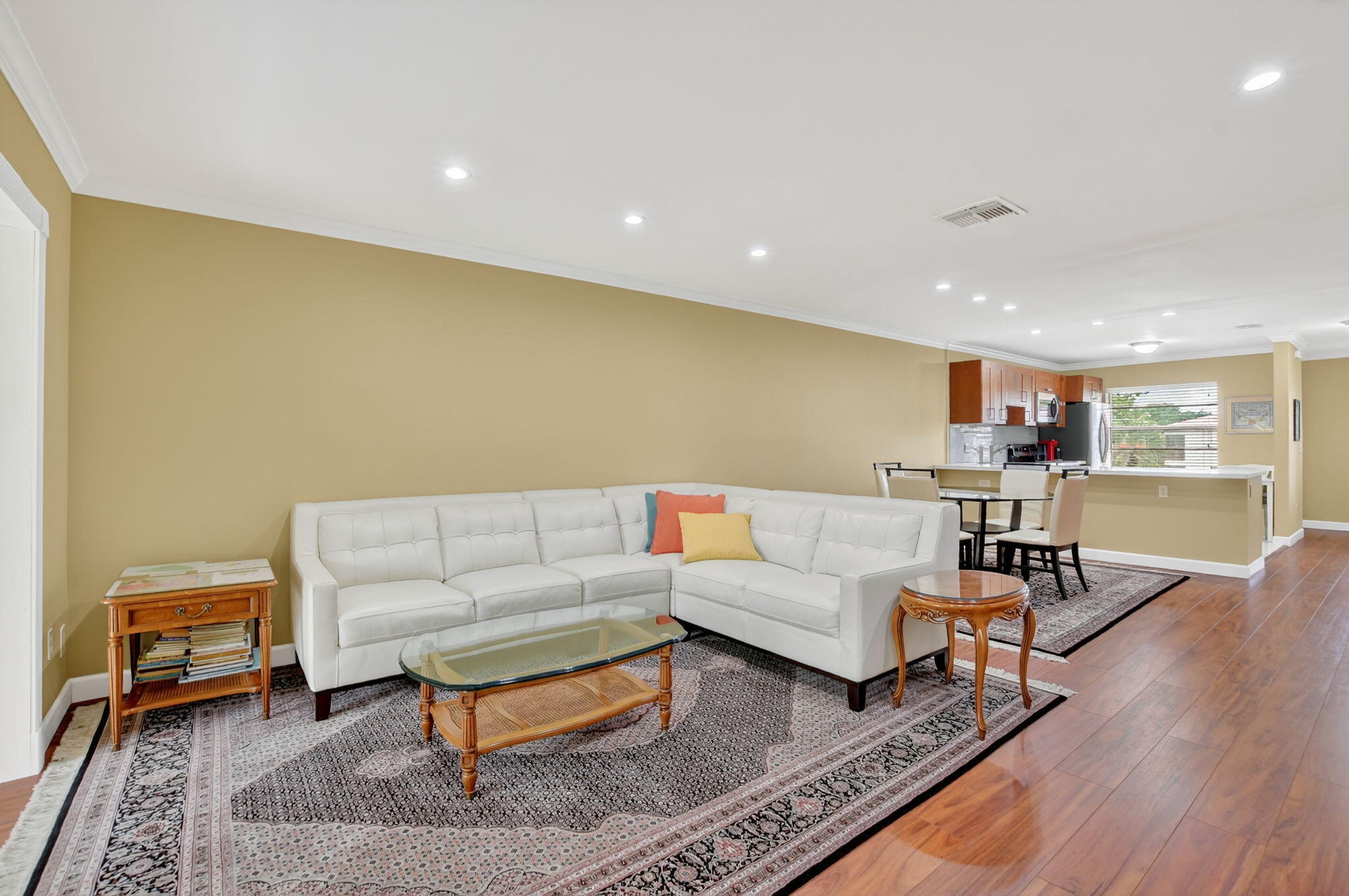 9268 Vista Del Lago, Unit 26D Boca Raton, FL 33428 - Photo 13 of 34 a living room with furniture and a wooden floor