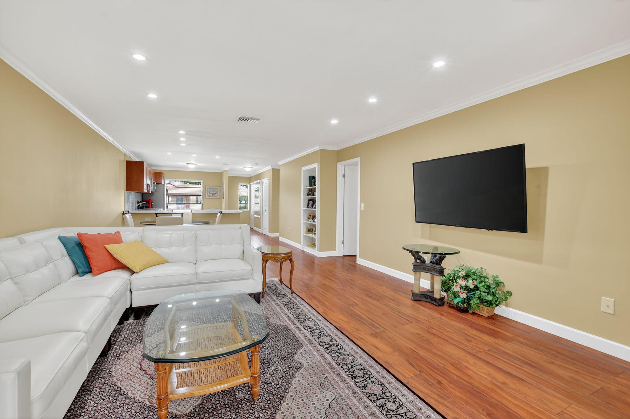 9268 Vista Del Lago, Unit 26D Boca Raton, FL 33428 - Photo 14 of 34 a living room with furniture and a flat screen tv