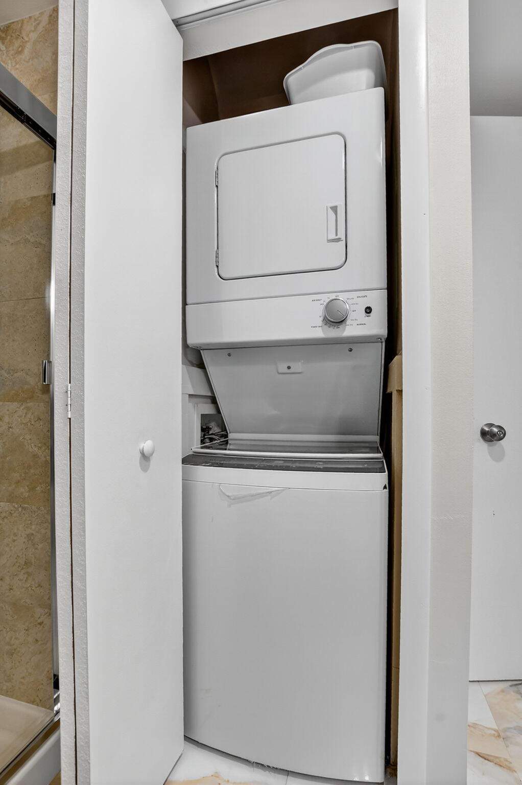9268 Vista Del Lago, Unit 26D Boca Raton, FL 33428 - Photo 24 of 34 a utility room with dryer and washer