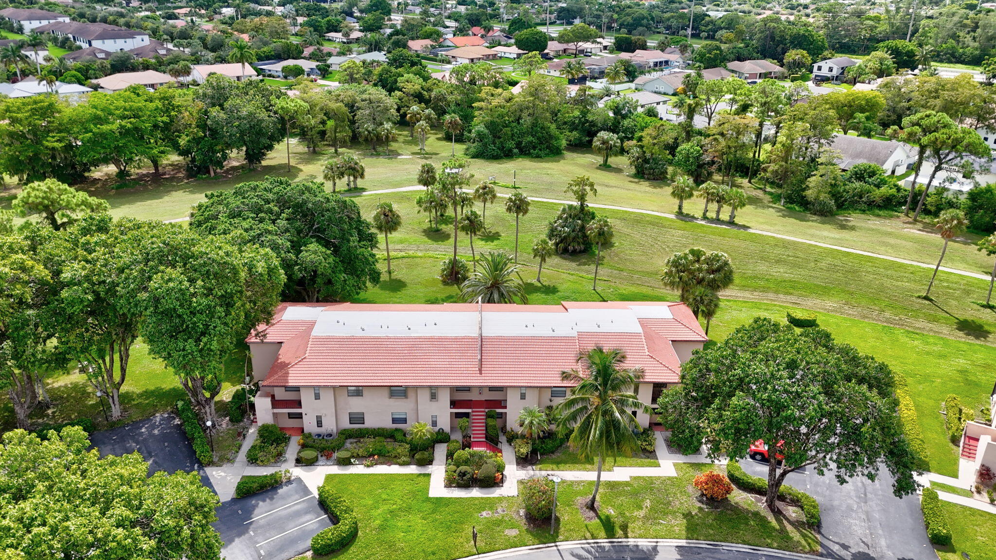 9268 Vista Del Lago, Unit 26D Boca Raton, FL 33428 - Photo 29 of 34 an aerial view of residential houses with outdoor space and street view