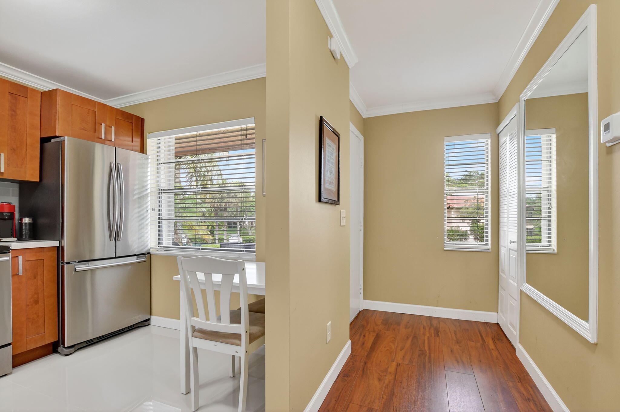 9268 Vista Del Lago, Unit 26D Boca Raton, FL 33428 - Photo 3 of 34 a kitchen with stainless steel appliances a refrigerator and a window