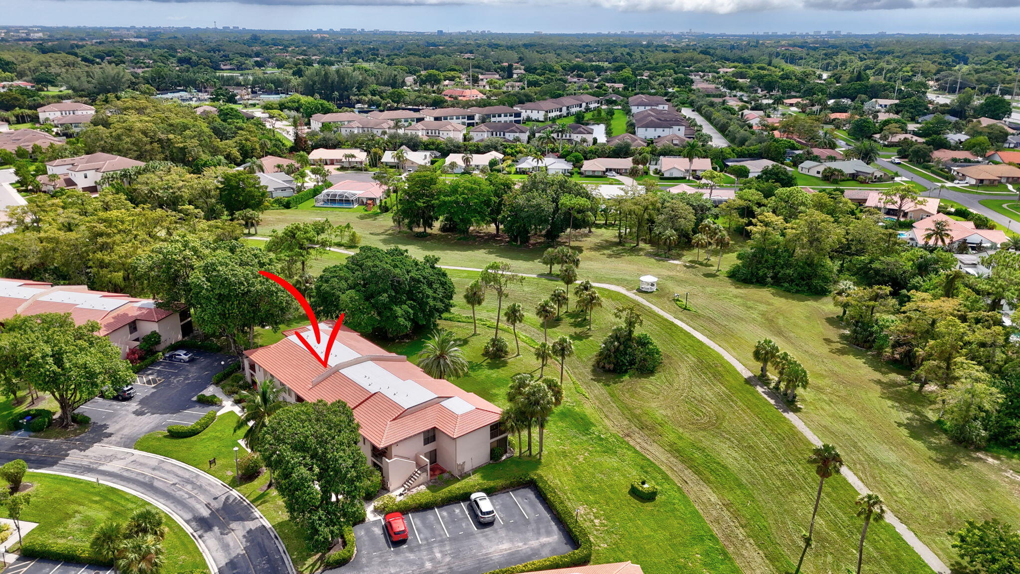 9268 Vista Del Lago, Unit 26D Boca Raton, FL 33428 - Photo 31 of 34 an aerial view of a house with a garden