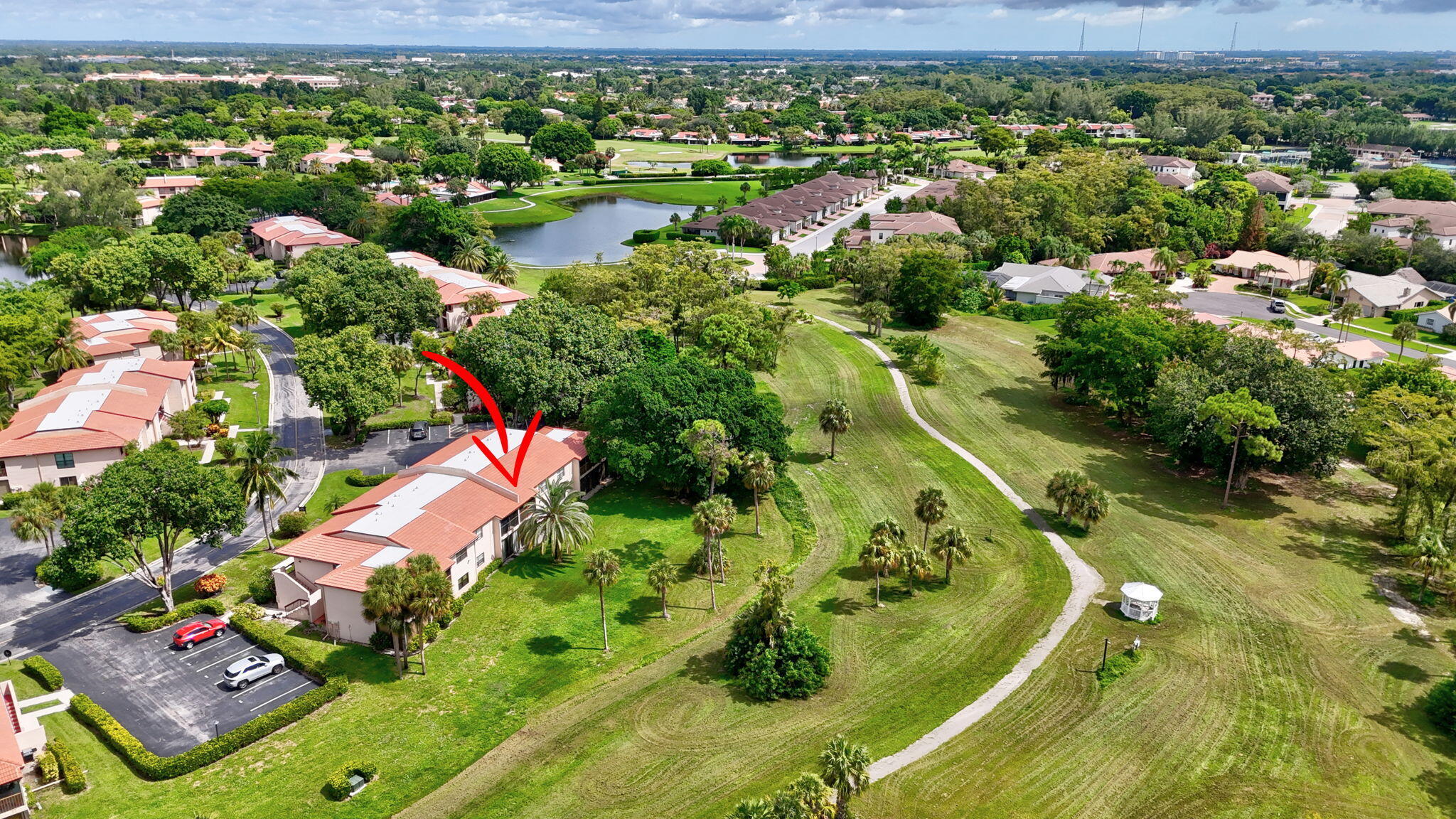 9268 Vista Del Lago, Unit 26D Boca Raton, FL 33428 - Photo 32 of 34 an aerial view of residential houses with outdoor space and trees