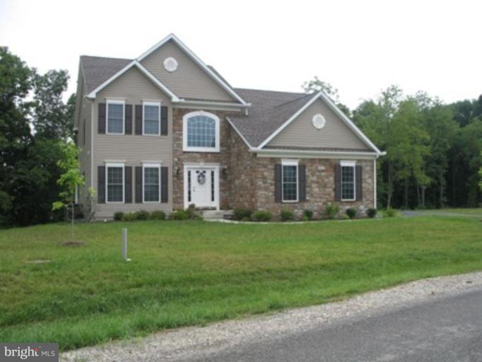846 Rivanna Run Falling Waters, WV 25419 - Photo 1 of 14 a front view of a house with a garden