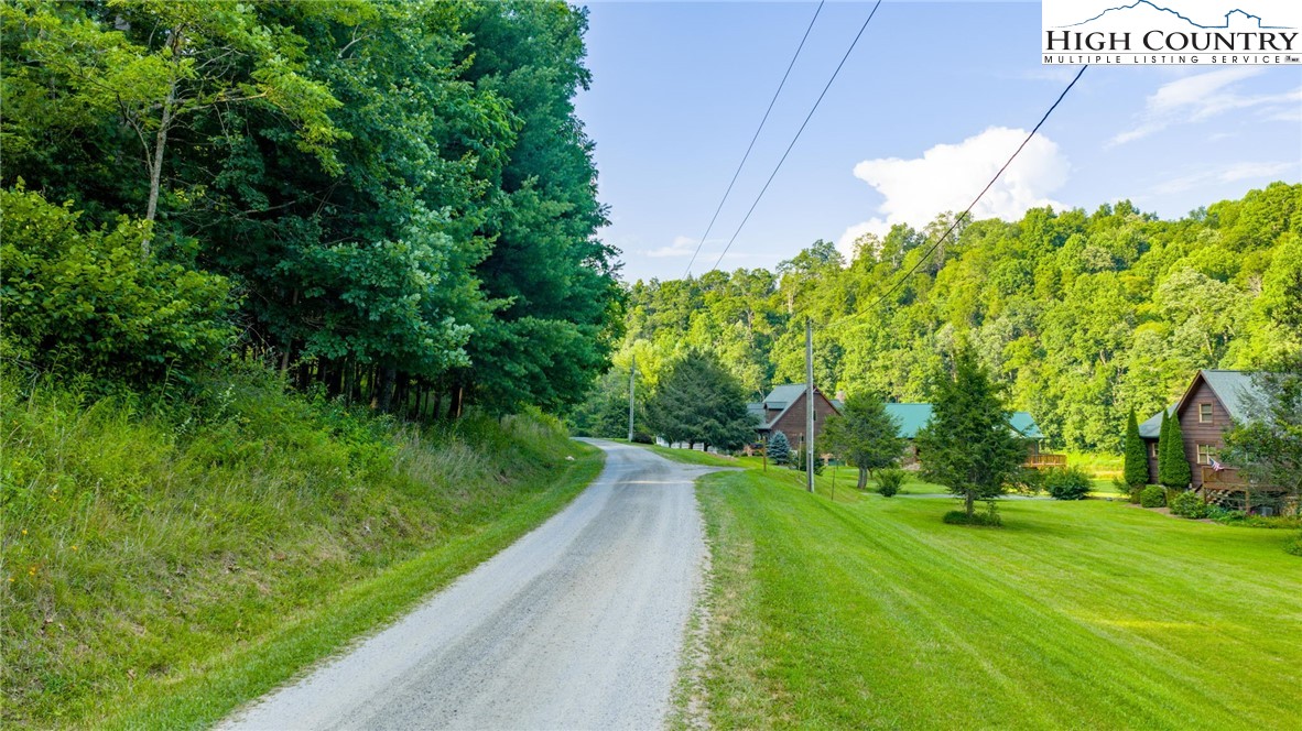 16 Bill Cooper Road Extension Crumpler, NC 28617 - Photo 5 of 21 a view of a street with a garden