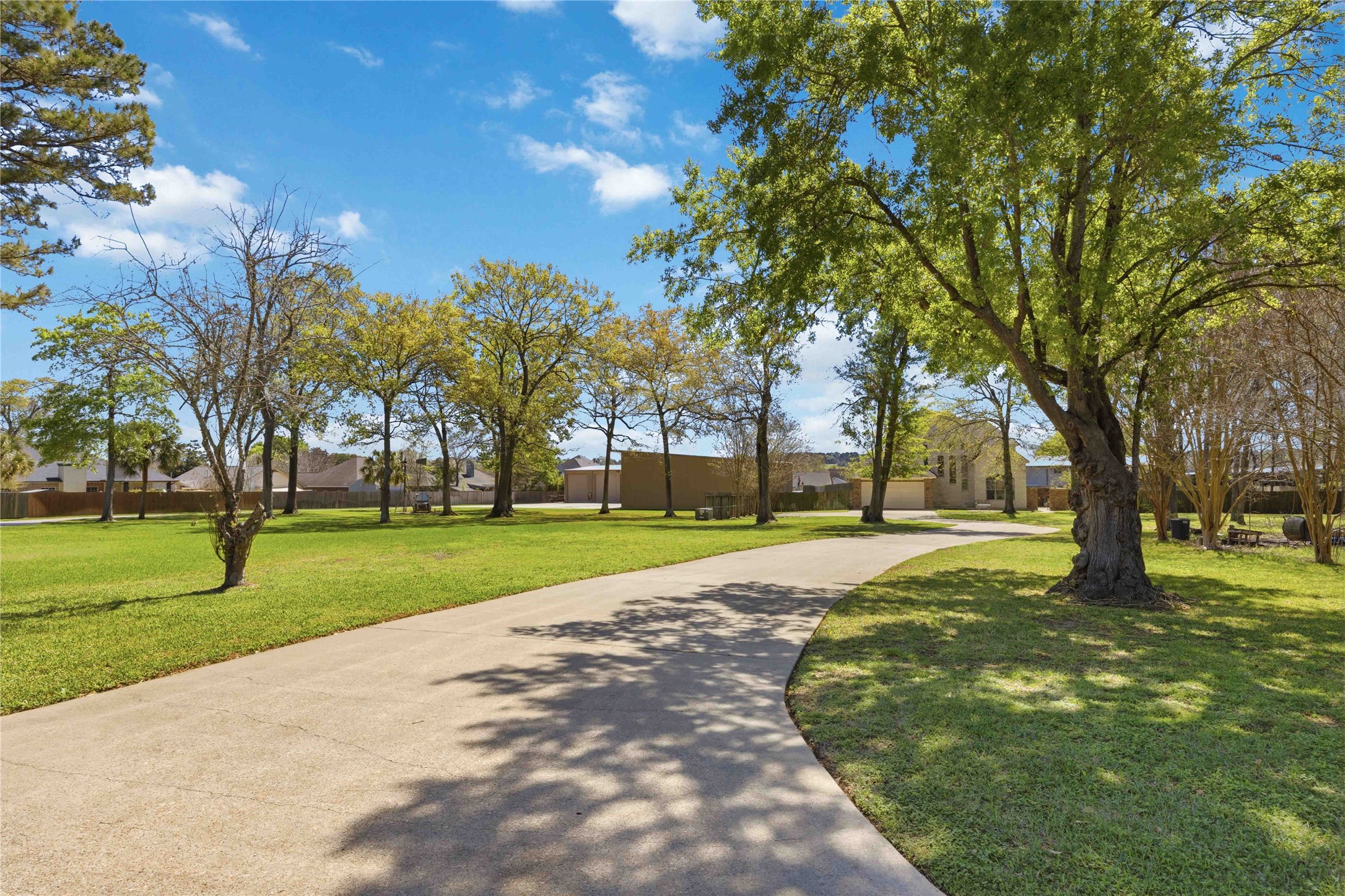 1930 Old River Road Montgomery, TX 77356 - Photo 2 of 49 Mature trees line the driveway leading to your new home, just minutes from the Lake Conroe boat launch. This is truly a rare combination of space, privacy, and the perfect location!