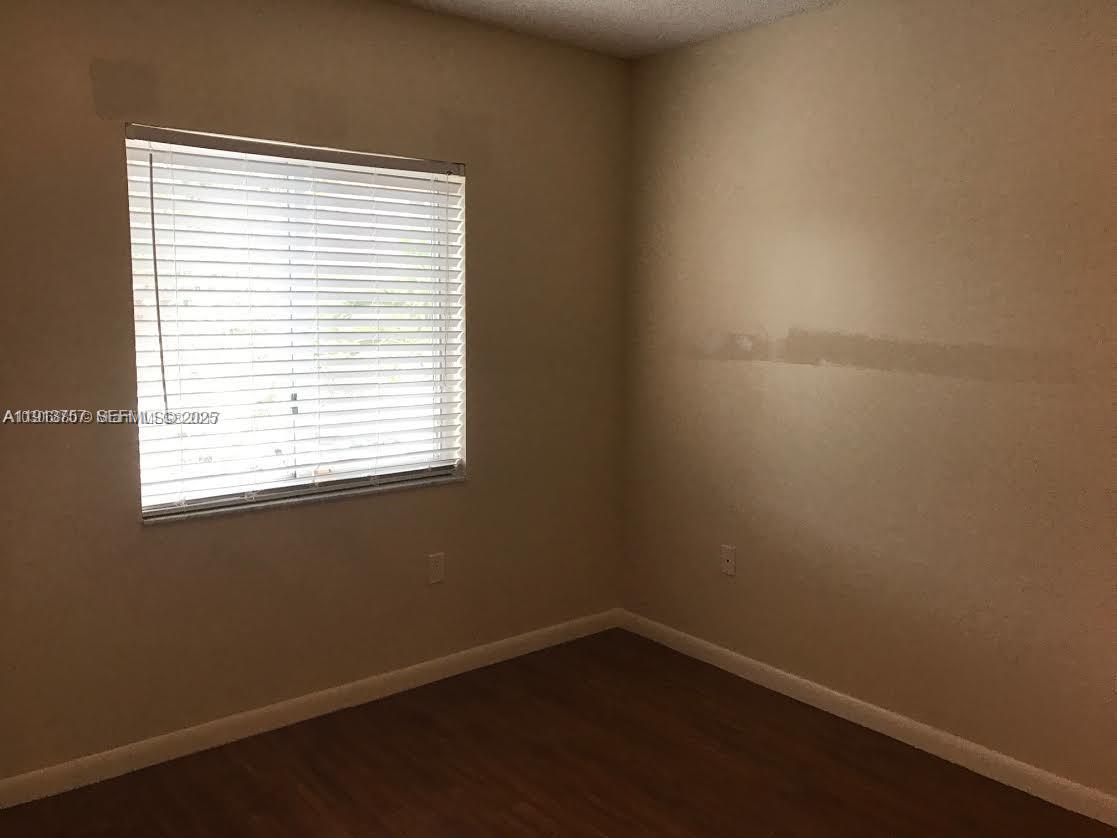 165 Riviera Circle, Unit 589 Weston, FL 33326 - Photo 5 of 15 an empty room with a window