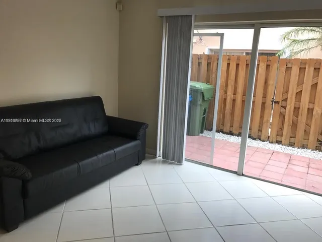 a living room with furniture and a gate