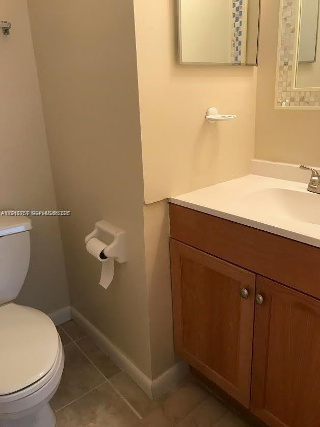 165 Riviera Circle, Unit 589 Weston, FL 33326 - Photo 10 of 15 a bathroom with a sink and a toilet