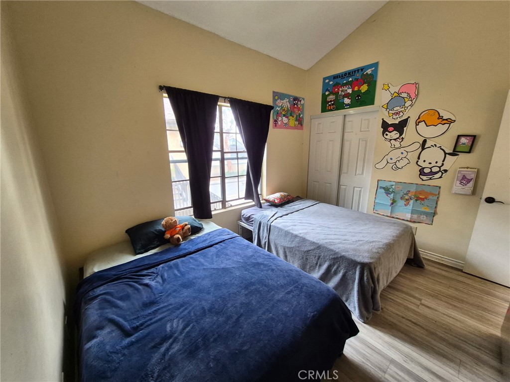 4140 Workman Mill Road, Unit 115 Whittier, CA 90601 - Photo 5 of 14 a bedroom with two beds and a table