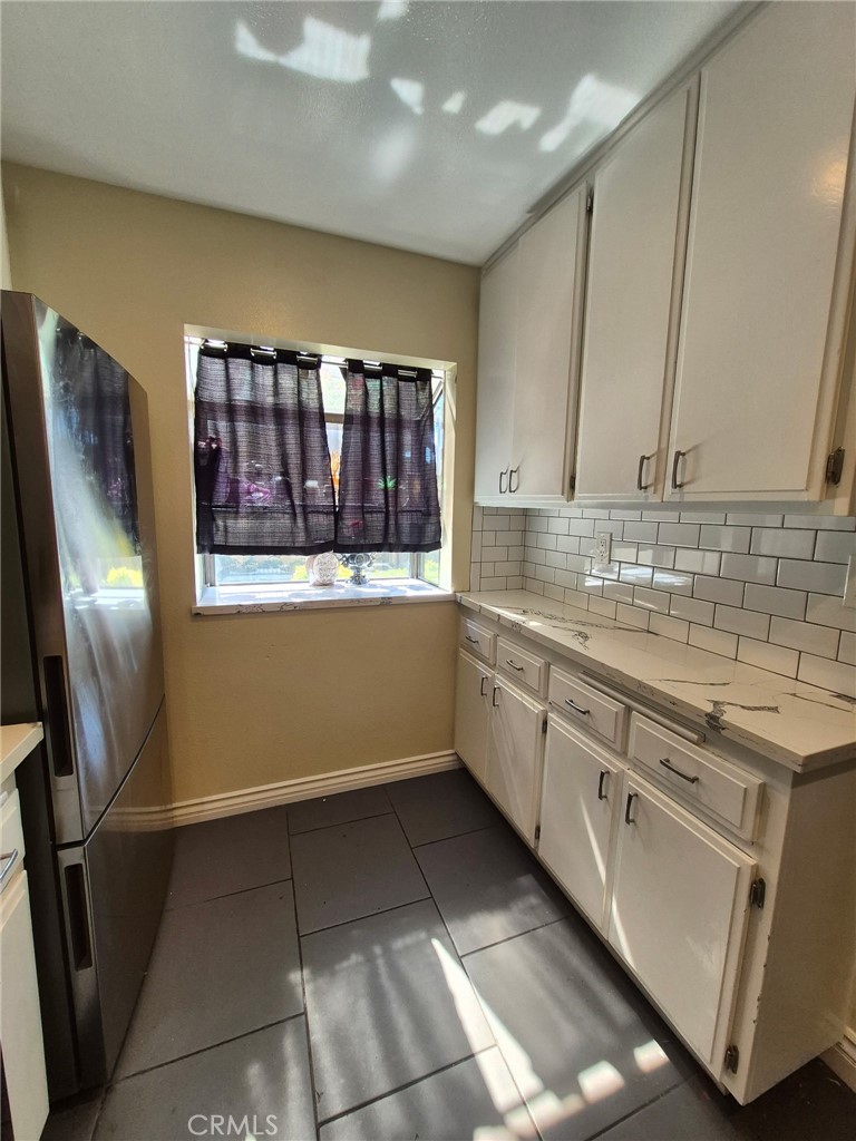 4140 Workman Mill Road, Unit 115 Whittier, CA 90601 - Photo 8 of 14 a kitchen with stainless steel appliances granite countertop a sink stove and refrigerator