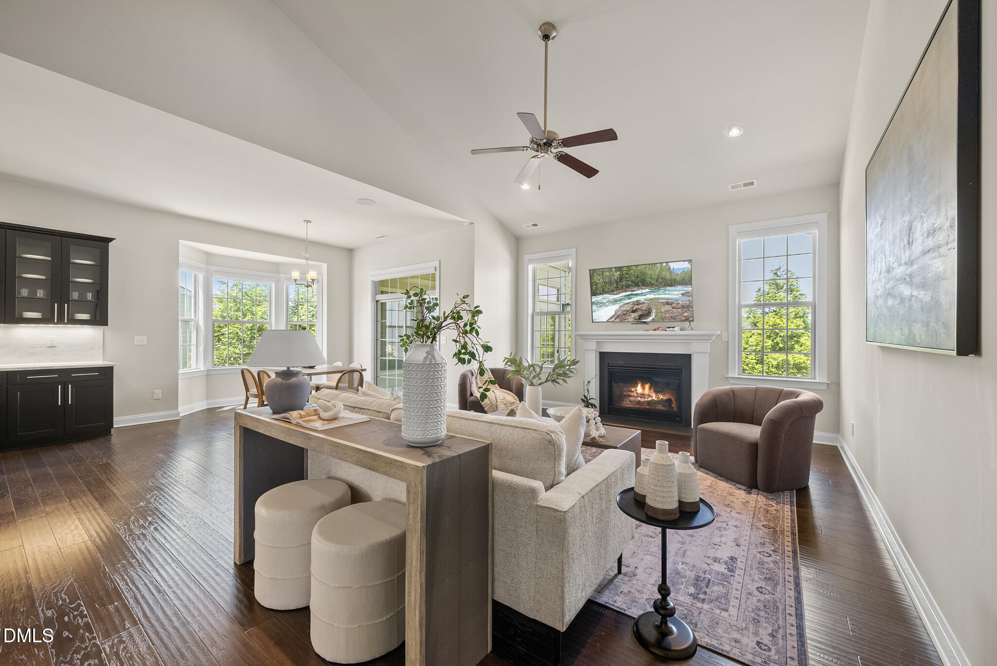 2648 Beckwith Road Apex, NC 27523 - Photo 16 of 59 a living room with furniture a fireplace and a window