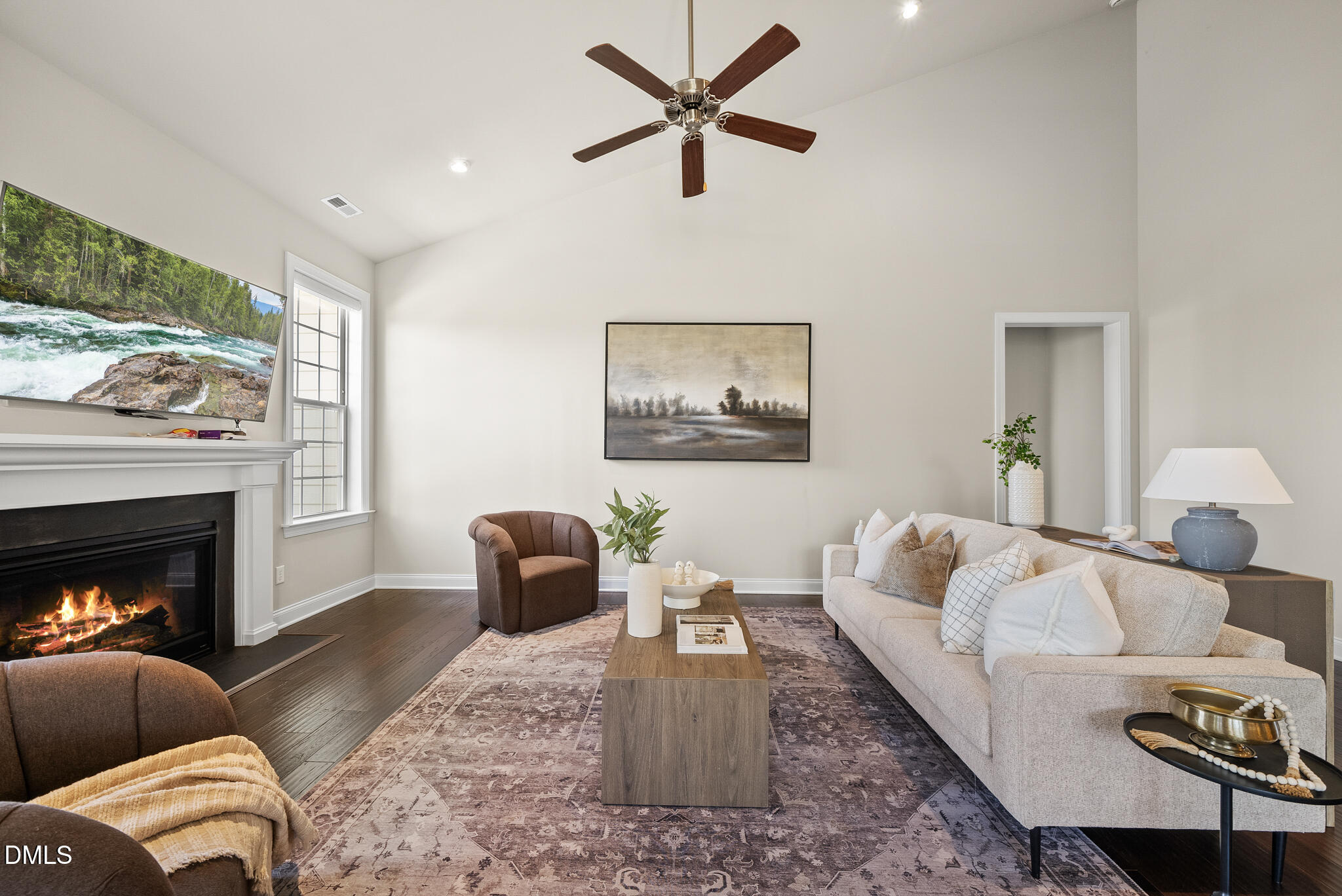 2648 Beckwith Road Apex, NC 27523 - Photo 18 of 59 a living room with furniture and a fireplace