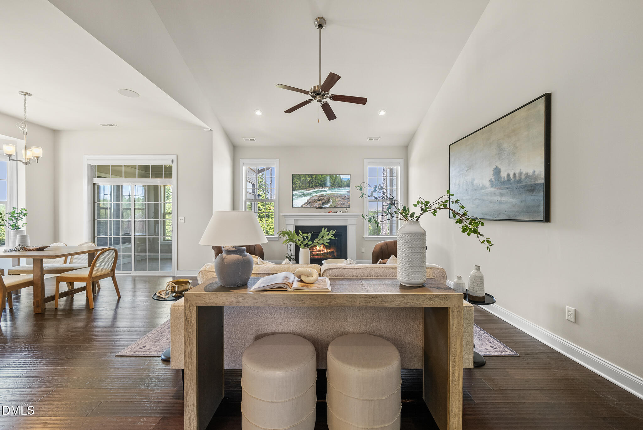 2648 Beckwith Road Apex, NC 27523 - Photo 19 of 59 a living room with fireplace furniture and a wooden floor