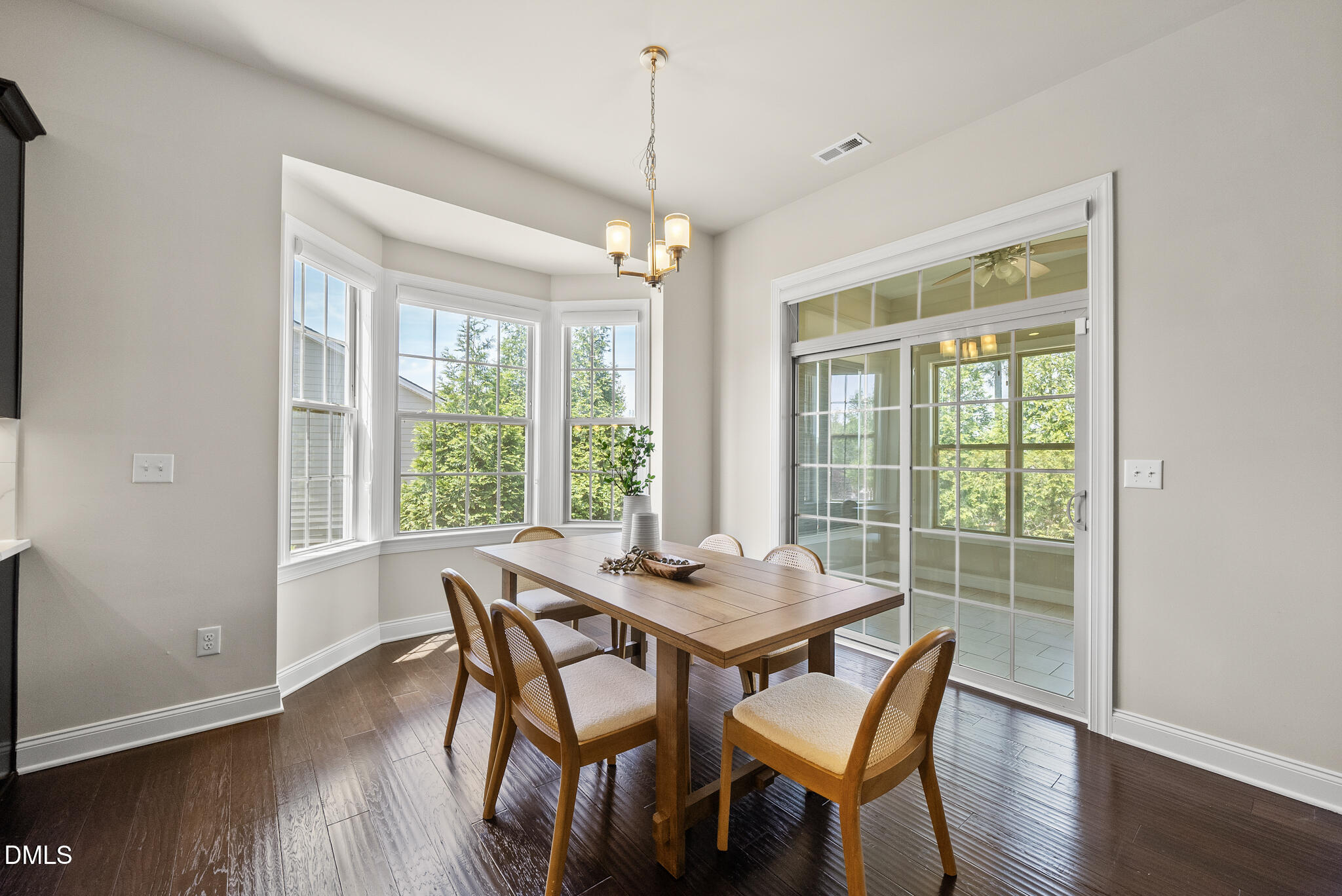 2648 Beckwith Road Apex, NC 27523 - Photo 21 of 59 a dining room with furniture window wooden floor