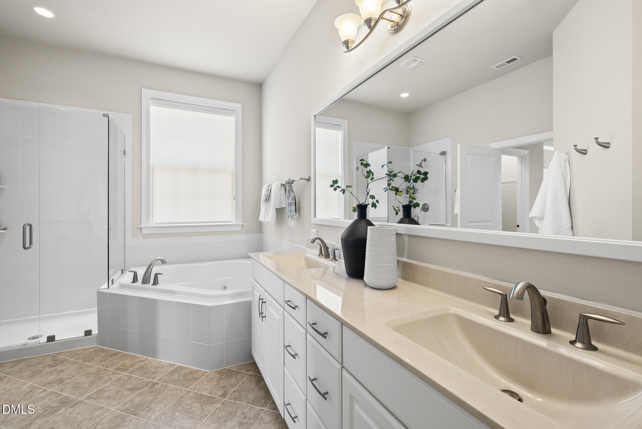 2648 Beckwith Road Apex, NC 27523 - Photo 29 of 59 a bathroom with a sink double vanity granite tub shower and a mirror
