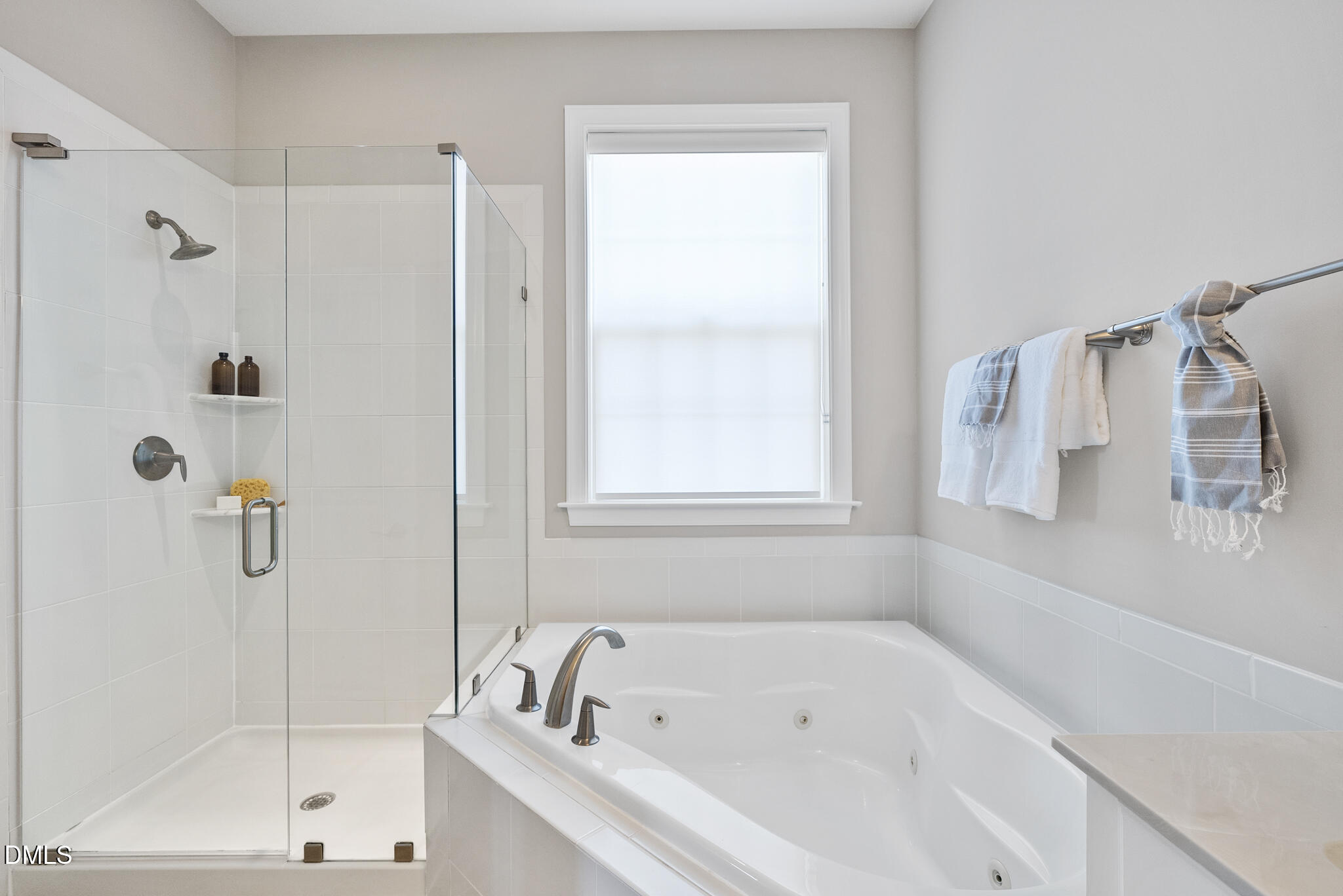 2648 Beckwith Road Apex, NC 27523 - Photo 30 of 59 a white bath tub sitting next to a white sink and a shower