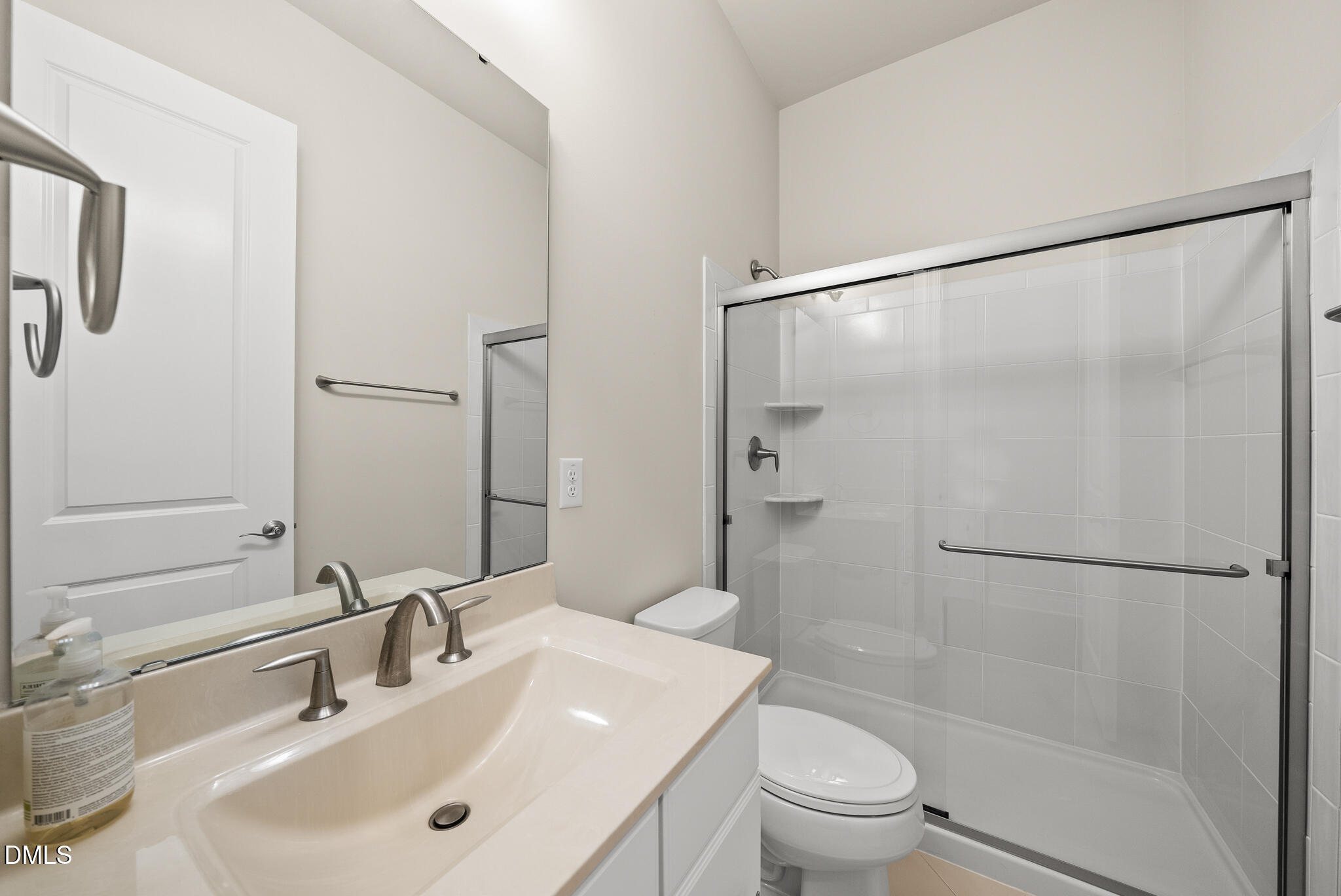 2648 Beckwith Road Apex, NC 27523 - Photo 34 of 59 a bathroom with a sink toilet and shower