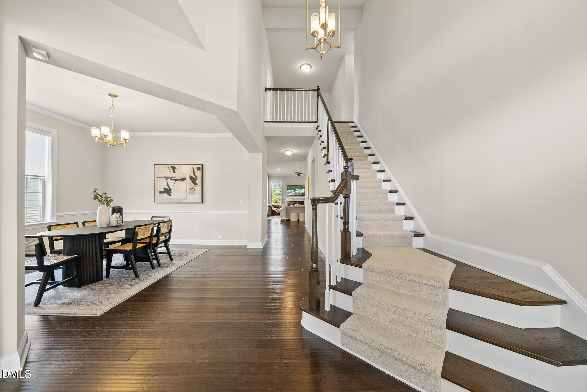 2648 Beckwith Road Apex, NC 27523 - Photo 4 of 59 a view of entryway and dining room with wooden floor