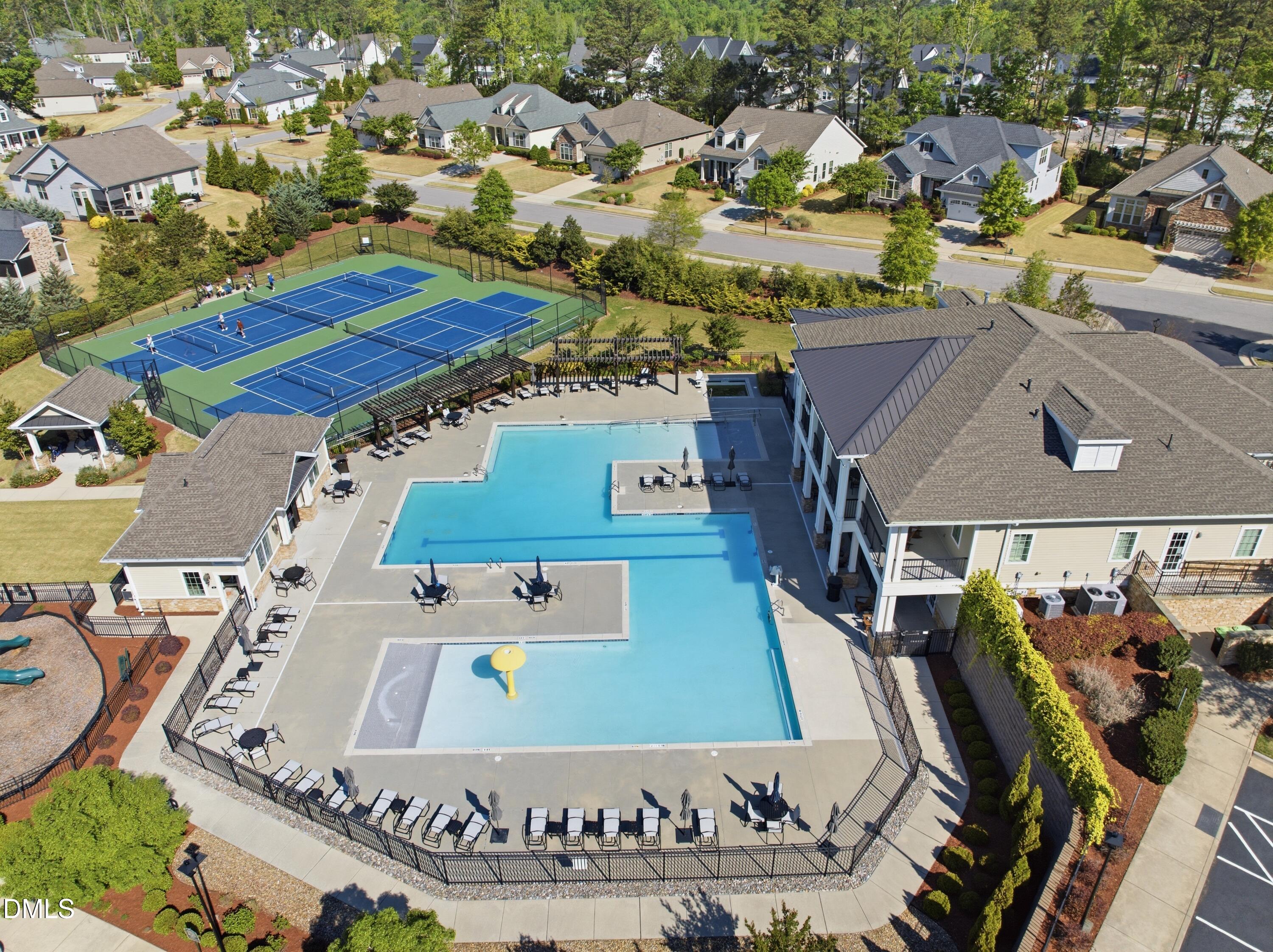 2648 Beckwith Road Apex, NC 27523 - Photo 51 of 59 an aerial view of a house with a swimming pool yard and lake view