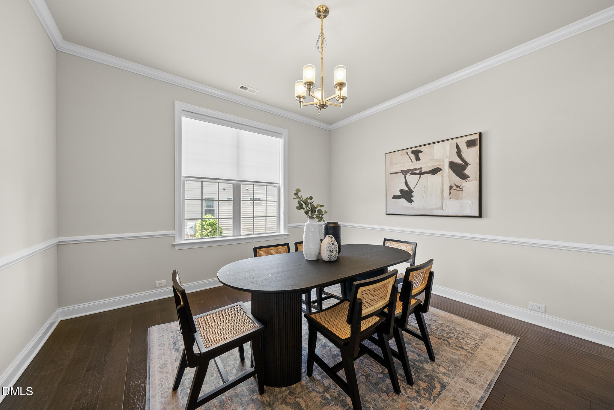2648 Beckwith Road Apex, NC 27523 - Photo 8 of 59 a dining room with furniture a rug and a chandelier