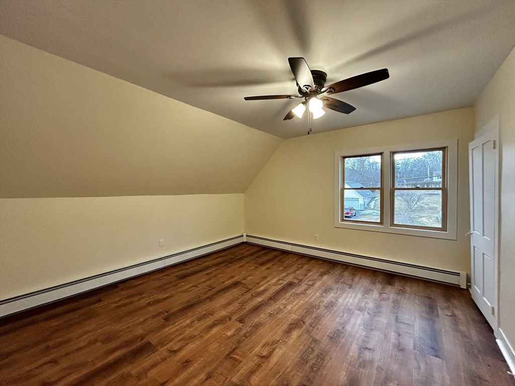 46 Elm Street, Unit 2 Buckland, MA 01370 - Photo 9 of 15 a view of an empty room with window and wooden floor