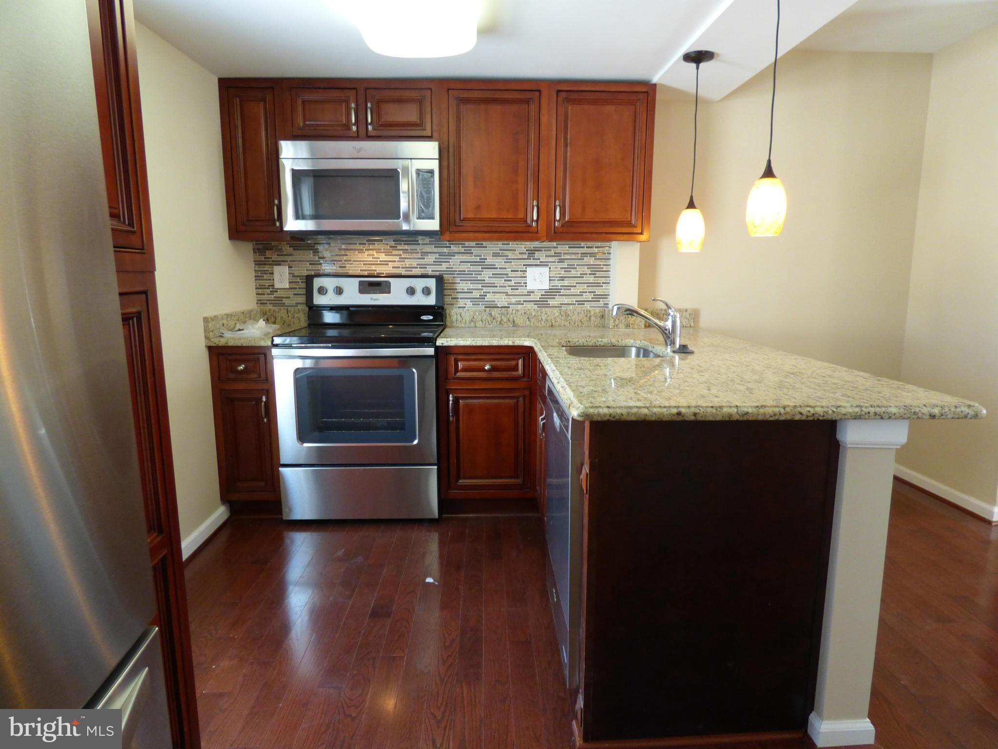 2064 Bethel Road Finksburg, MD 21048 - Photo 11 of 30 a kitchen with appliances a sink and a microwave