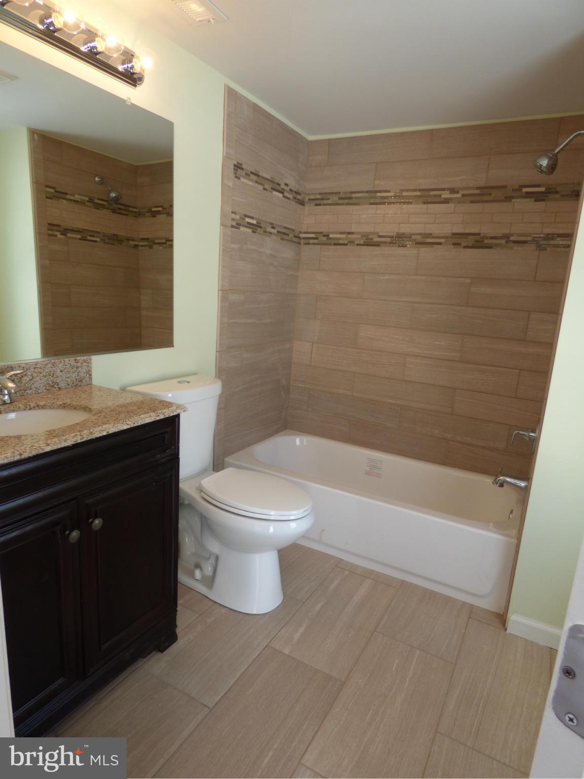 2064 Bethel Road Finksburg, MD 21048 - Photo 15 of 30 a bathroom with a sink a toilet and shower