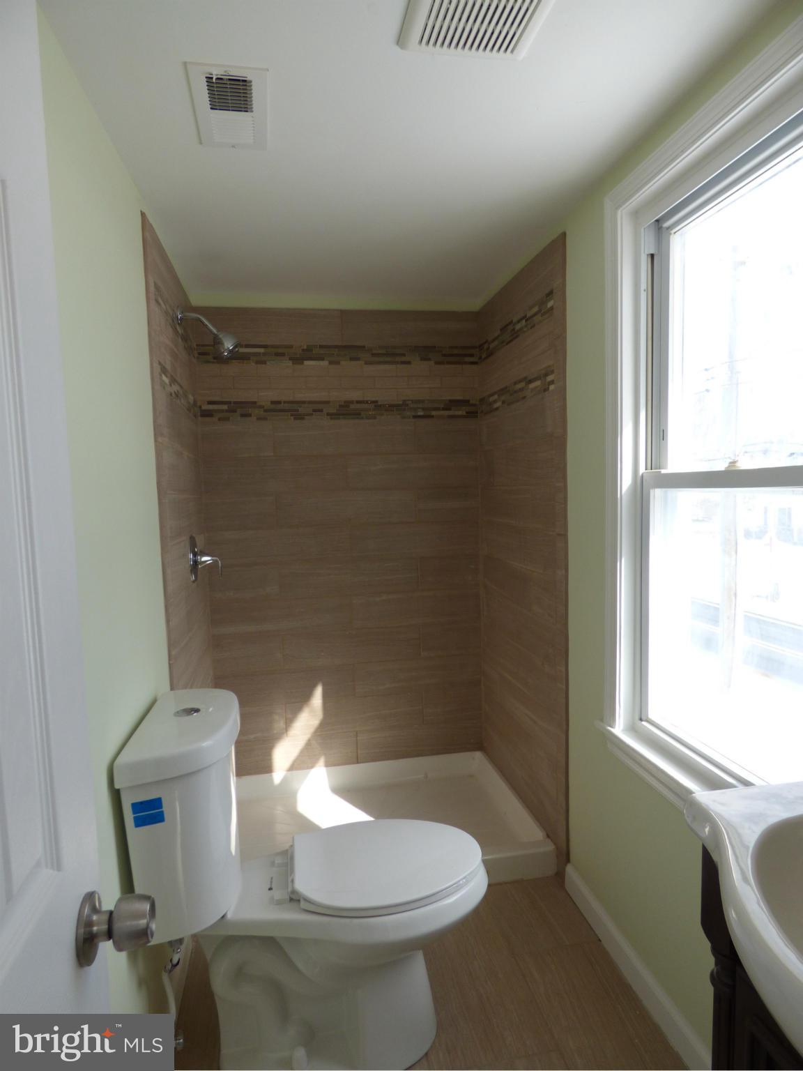 2064 Bethel Road Finksburg, MD 21048 - Photo 23 of 30 a bathroom with a toilet and a shower