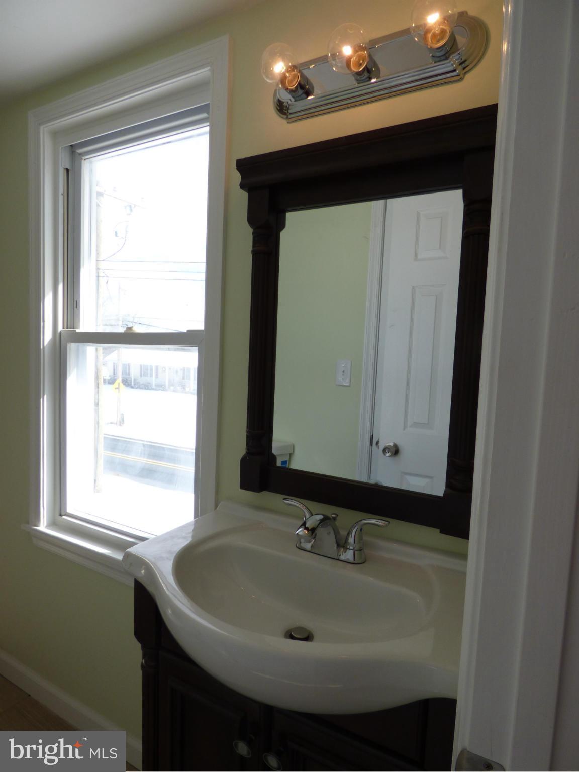 2064 Bethel Road Finksburg, MD 21048 - Photo 25 of 30 a bathroom with a sink and a mirror