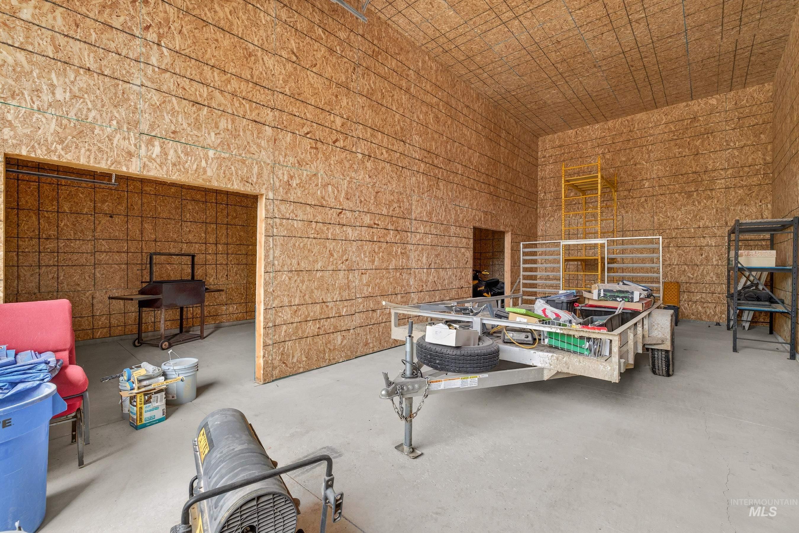 10191 Timberrim Drive Cascade, ID 83611 - Photo 37 of 44 Miscellaneous room featuring a high ceiling and concrete flooring