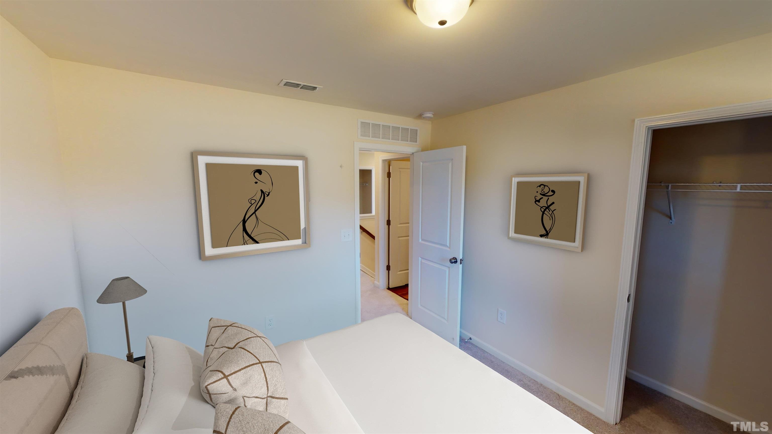 3457 Dragonfly River Court Raleigh, NC 27604 - Photo 11 of 25 a bedroom with a bed and a painting on the wall