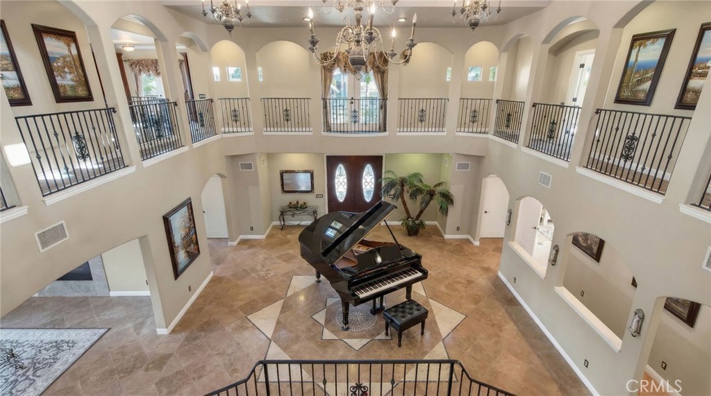 6959 Wyndham Hill Drive Riverside, CA 92506 - Photo 11 of 75 a view of a livingroom with furniture staircase and a floor to ceiling window
