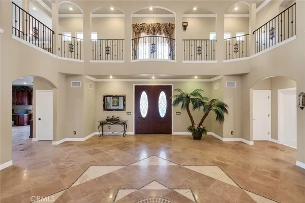 a kitchen with stainless steel appliances granite countertop a stove a refrigerator and a sink