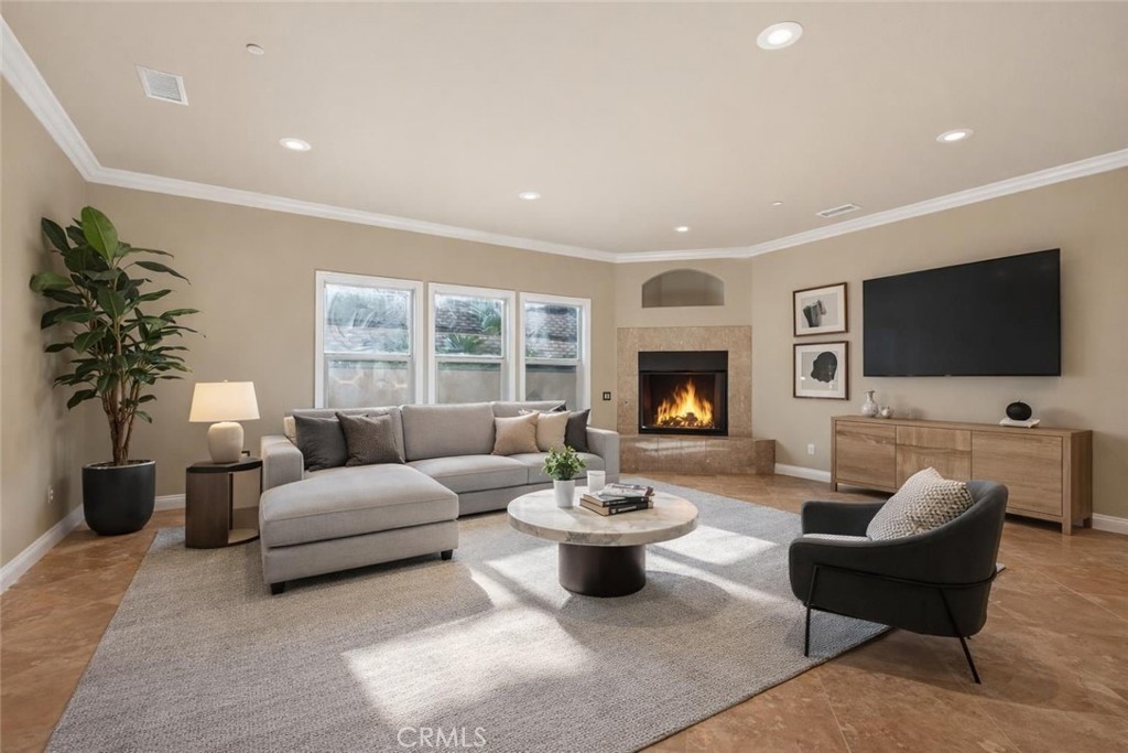 6959 Wyndham Hill Drive Riverside, CA 92506 - Photo 29 of 75 a living room with furniture flat screen tv and a fireplace