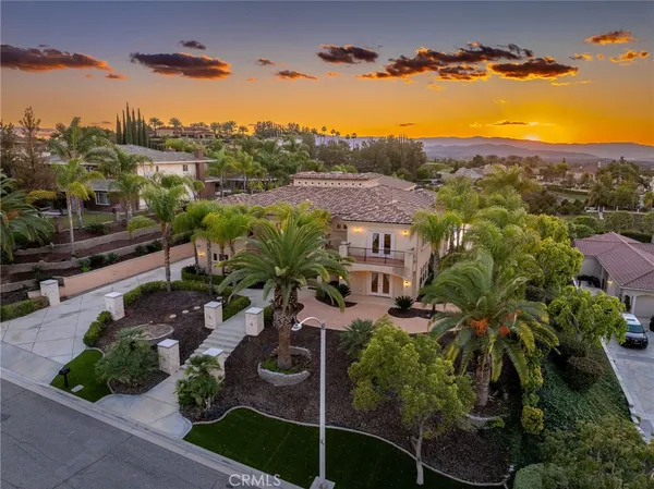 a view of a palm trees in front of a building