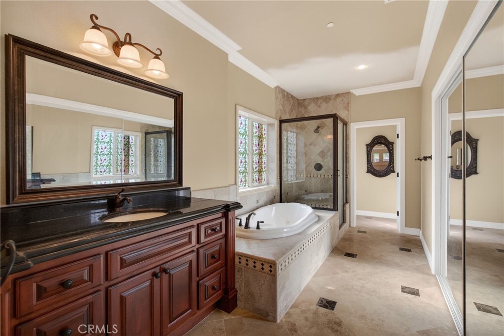 6959 Wyndham Hill Drive Riverside, CA 92506 - Photo 32 of 75 a bathroom with a sink a toilet and shower