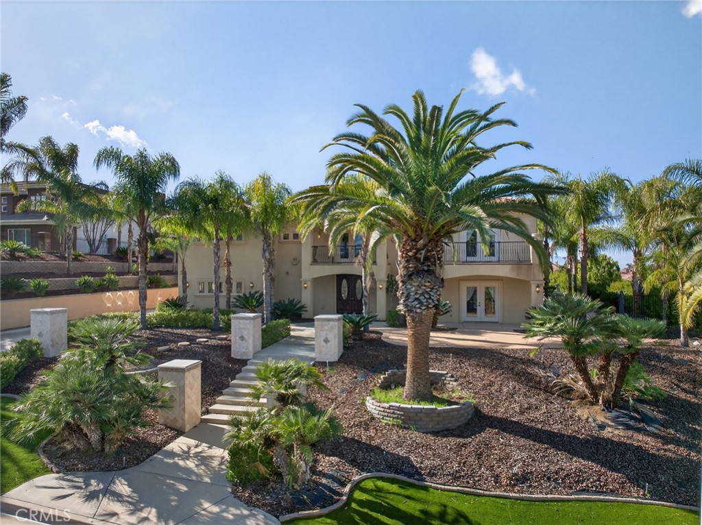 6959 Wyndham Hill Drive Riverside, CA 92506 - Photo 4 of 75 a front view of a house with garden