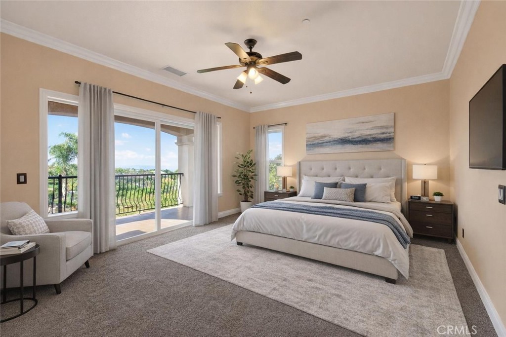 6959 Wyndham Hill Drive Riverside, CA 92506 - Photo 42 of 75 a spacious bedroom with a large bed and a chandelier